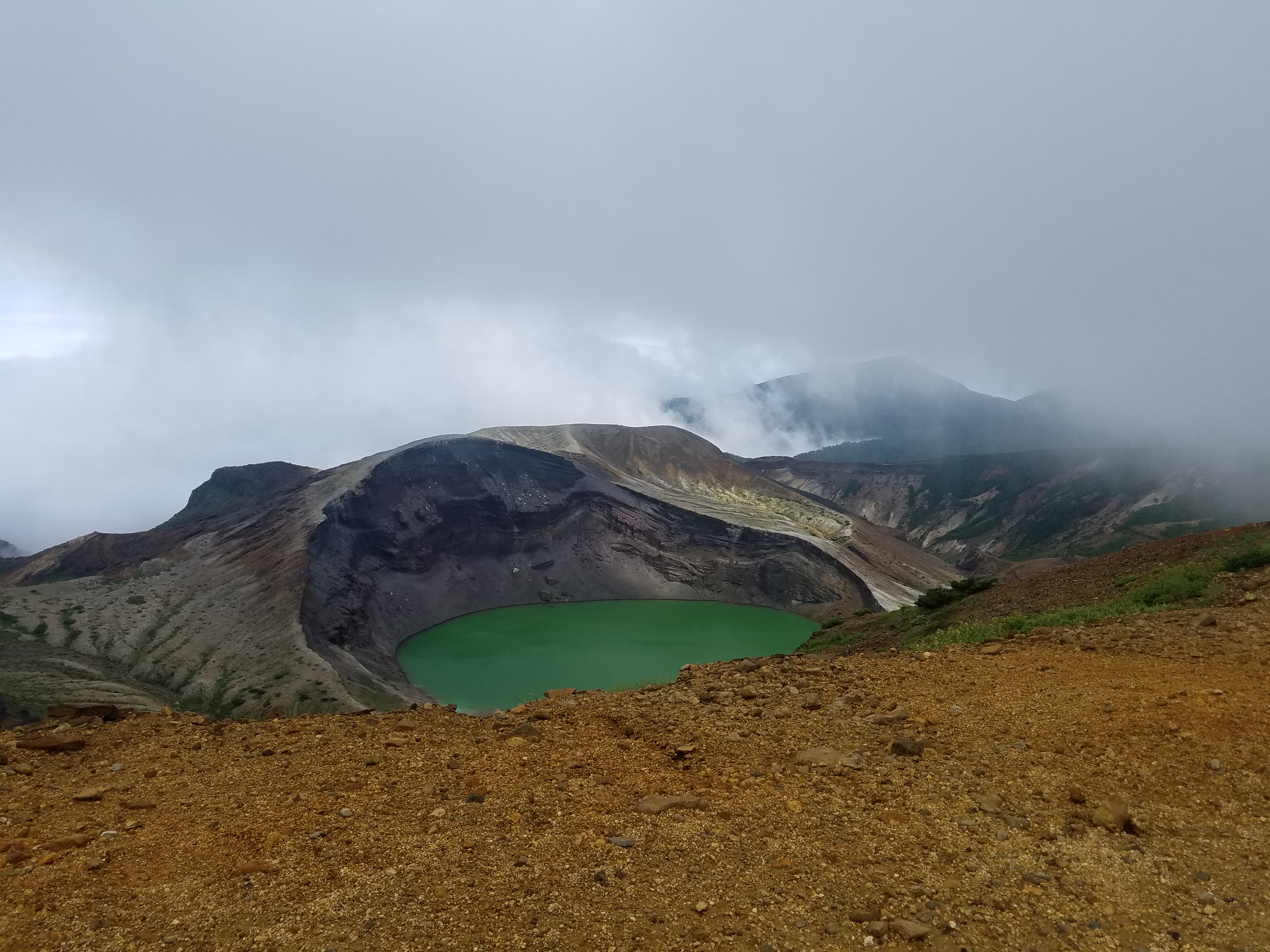 A picture of a crater on top of Mt.Zao